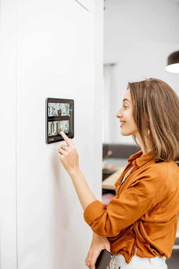woman accessing security tablet